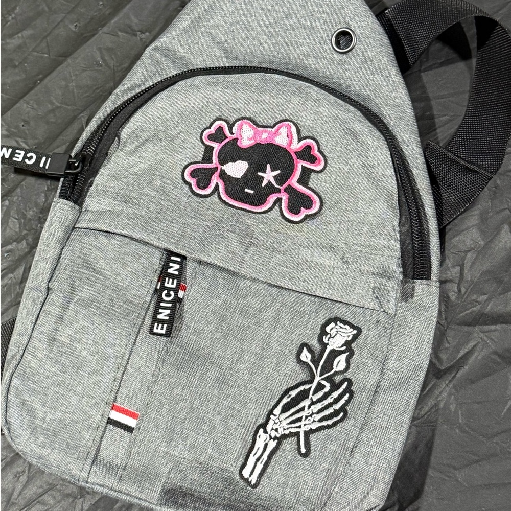 Gray Crossbody Bag with Pink Skull Design